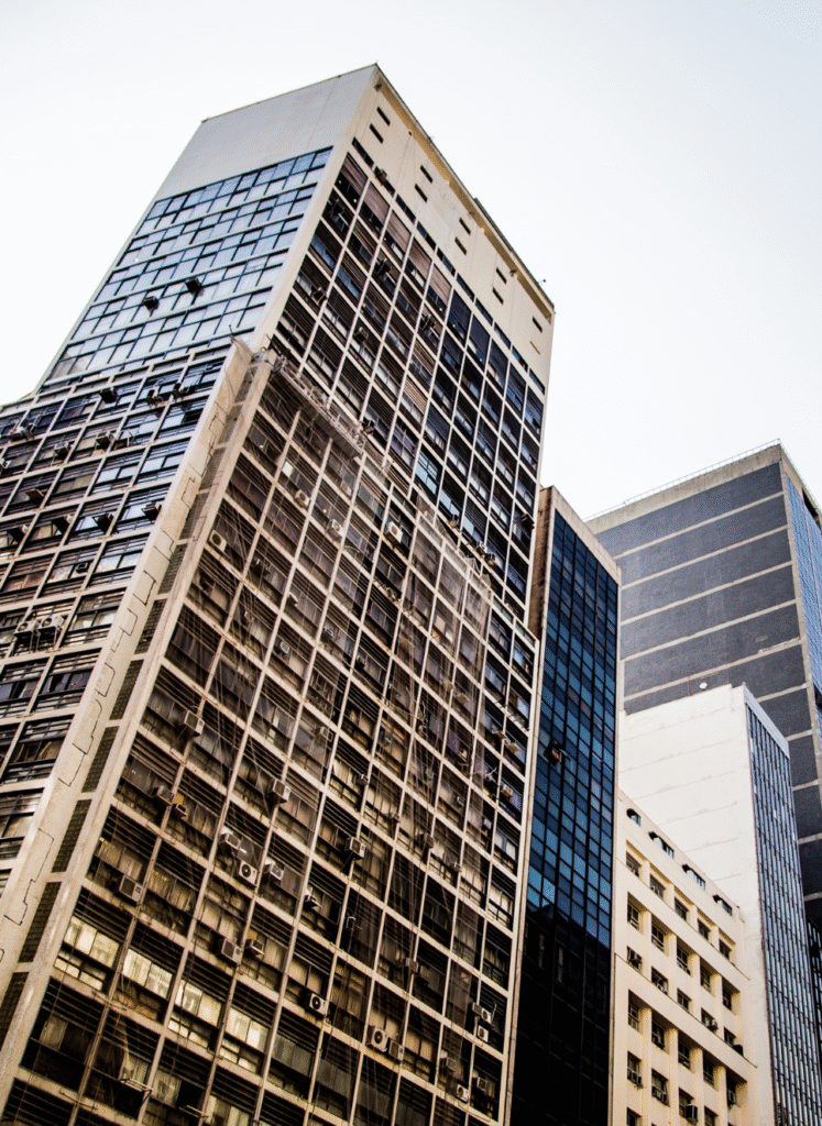 A tall commercial building with numerous windows, representing property management in Salem real estate.